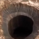 Illustration for article titled A Dramatic 260 Foot Crater Has Mysteriously Appeared In Siberia